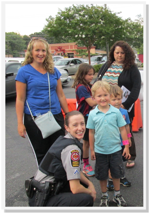 Fairfax County Community Police Officers greeting young residents.